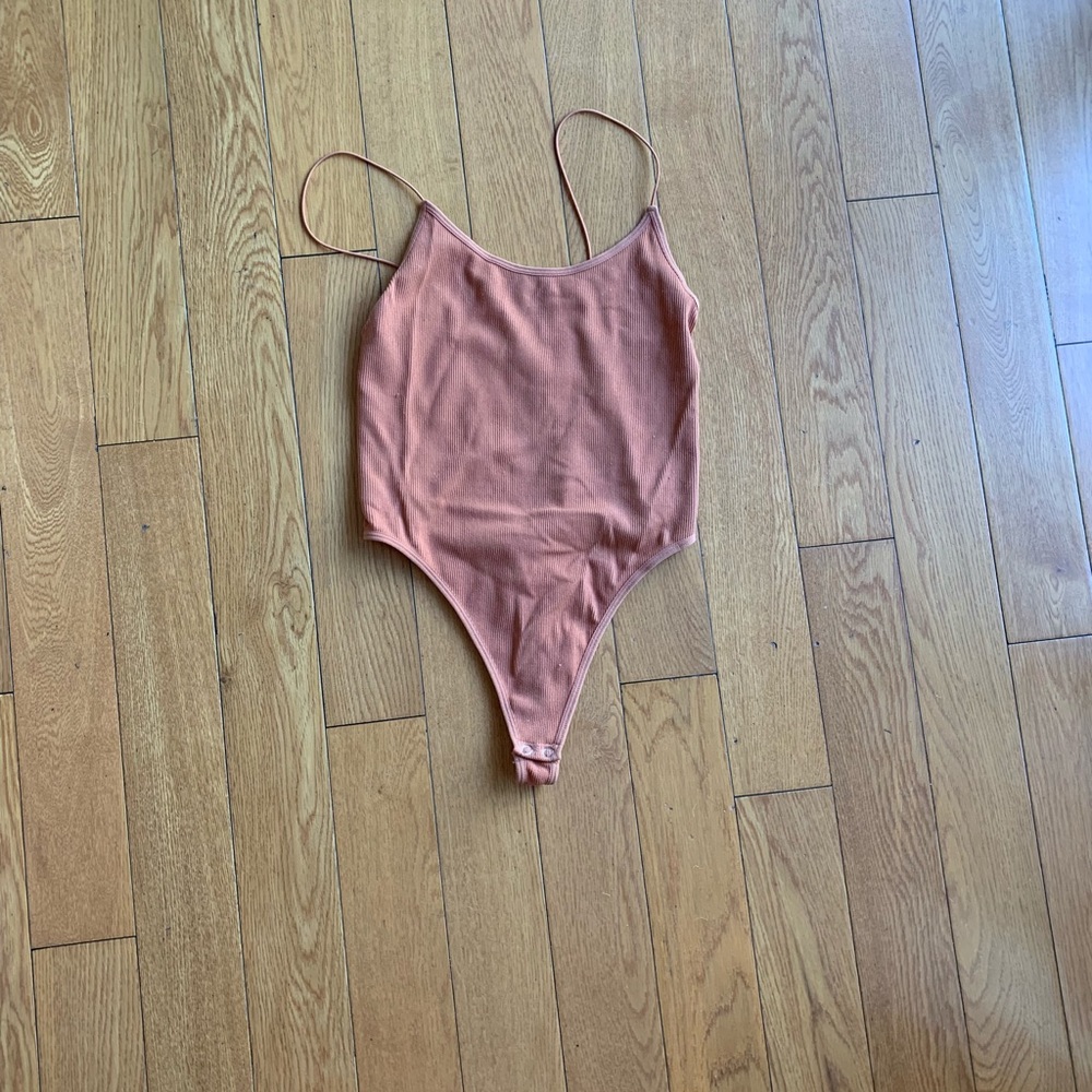 Worn one time copper bodysuit